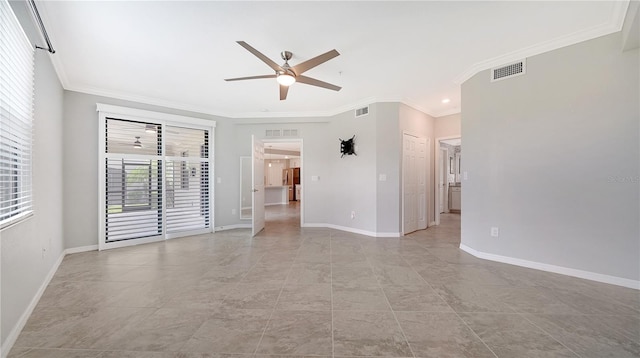 unfurnished room featuring ceiling fan and ornamental molding