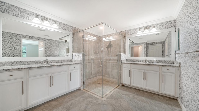 bathroom with vanity, crown molding, and an enclosed shower