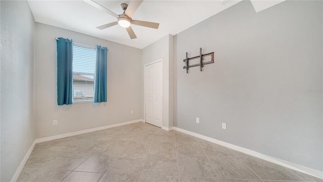 spare room featuring ceiling fan