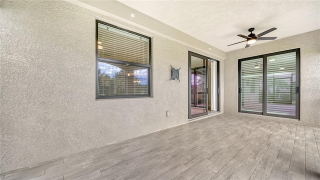 view of patio / terrace featuring ceiling fan