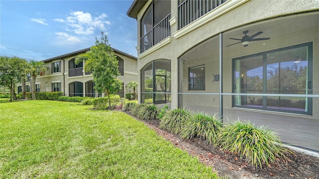 exterior space with ceiling fan