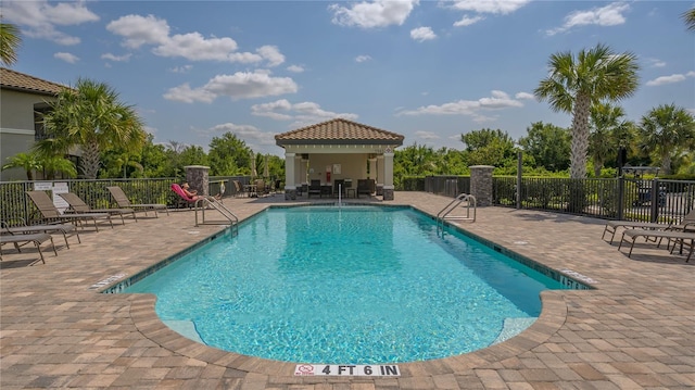 view of pool featuring a gazebo and a patio