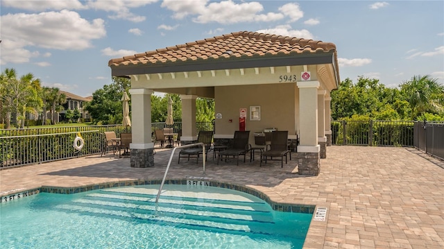 view of pool featuring a patio area and a gazebo