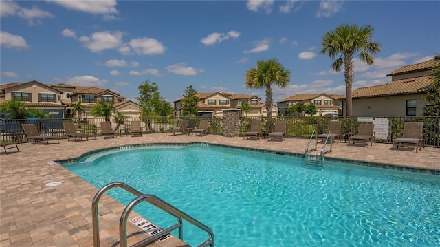 view of swimming pool with a patio area