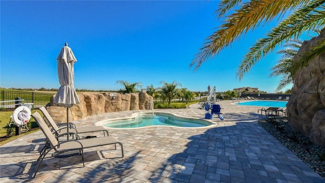 view of pool featuring a patio area