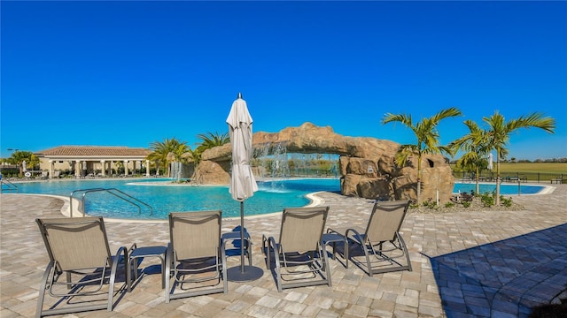 view of pool featuring pool water feature