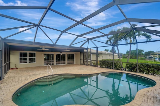 view of pool featuring a lanai, a patio, and ceiling fan