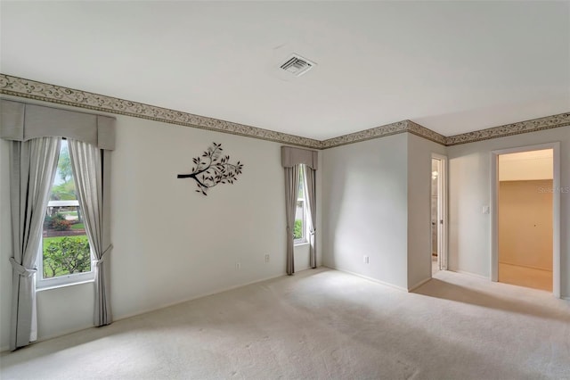 empty room featuring light colored carpet