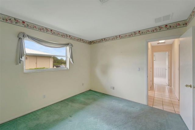 view of carpeted spare room