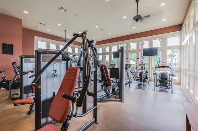 exercise room with ceiling fan