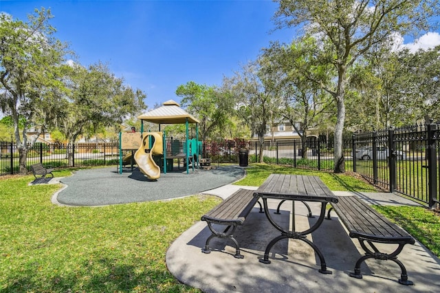 view of playground with a lawn