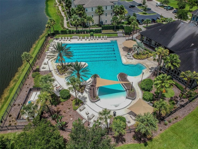 view of pool with a water view