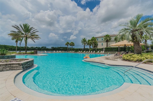 view of swimming pool with a patio area