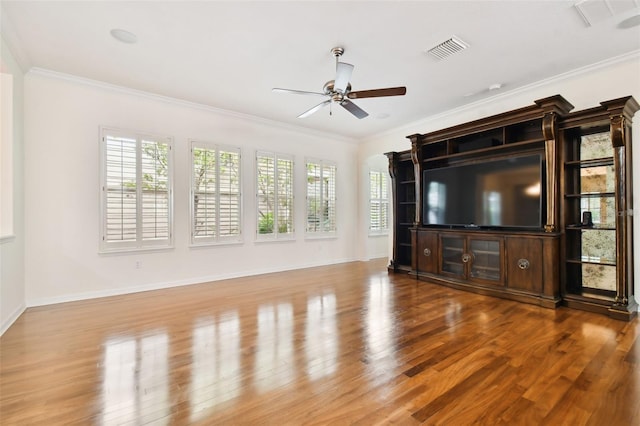 unfurnished living room with light hardwood / wood-style flooring and crown molding