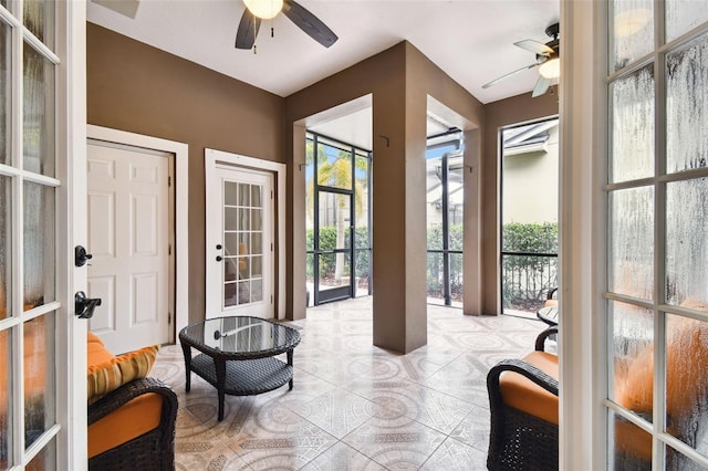 doorway with ceiling fan