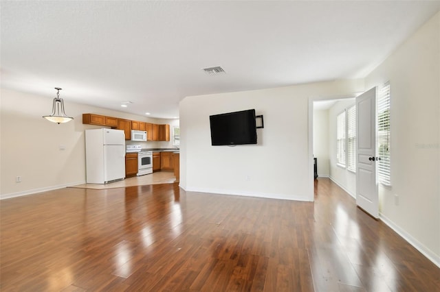 unfurnished living room featuring light hardwood / wood-style flooring