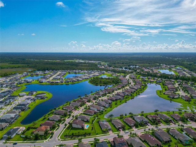 birds eye view of property featuring a residential view and a water view