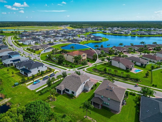 birds eye view of property featuring a water view