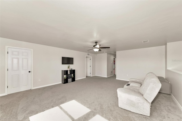 sitting room with a ceiling fan, visible vents, carpet, and baseboards