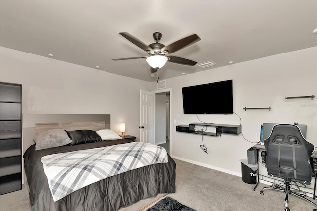 carpeted bedroom with a ceiling fan, visible vents, and baseboards