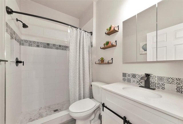 2352 Marton Oak Blvd, North Port, FL 34289 - bathroom featuring tiled shower, toilet, and vanity