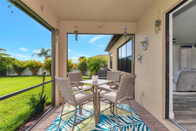 2352 Marton Oak Blvd, North Port, FL 34289 - sunroom / solarium featuring outdoor dining area