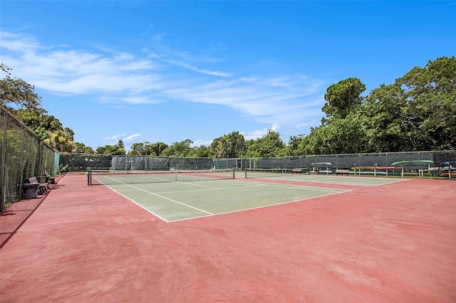 view of tennis court featuring basketball court