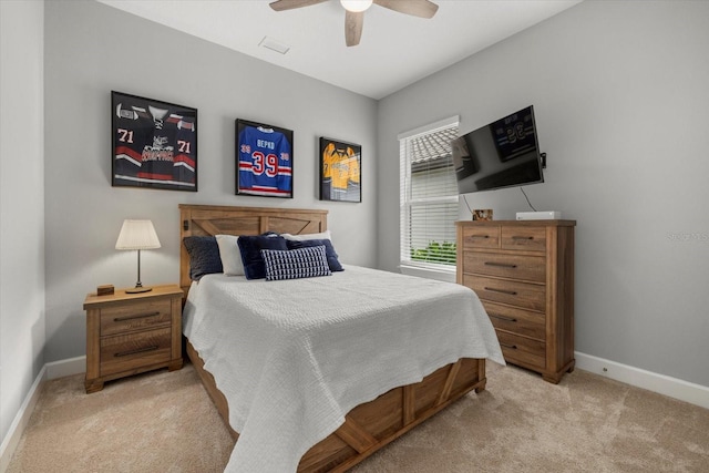 bedroom with ceiling fan and light colored carpet