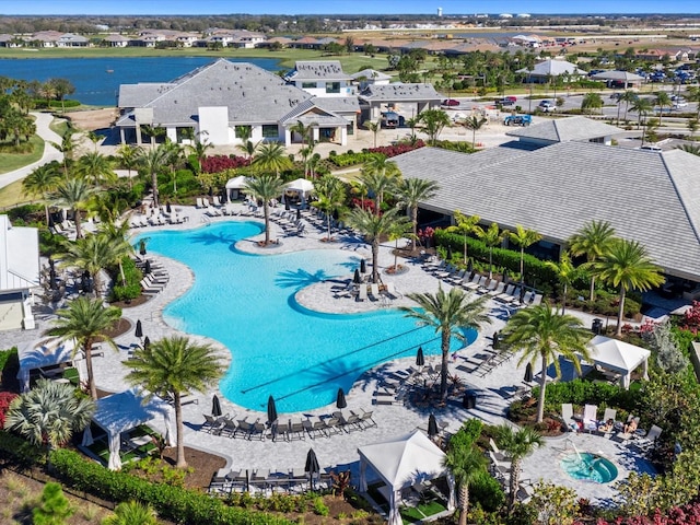 view of pool with a water view