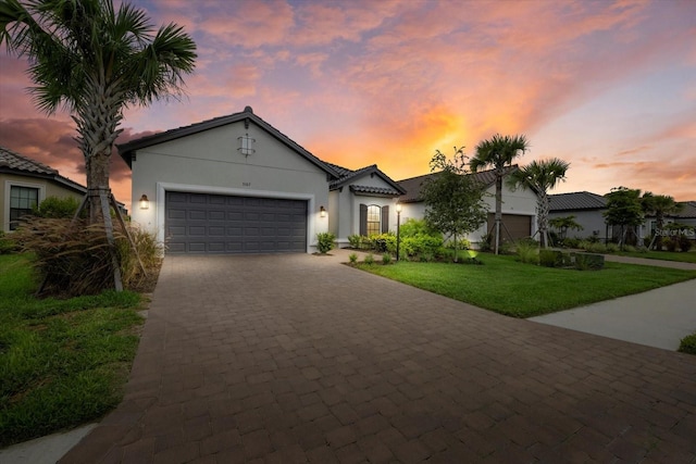 3107 Vittorio Ct, Bradenton, FL 34211 - view of front of property with stucco siding, an attached garage, decorative driveway, and a front lawn