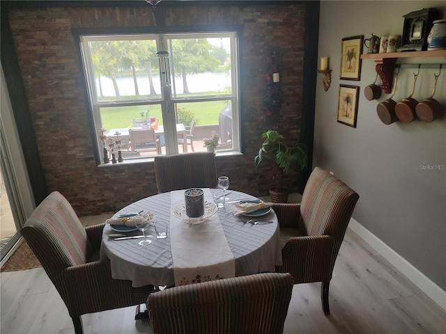 dining area with light hardwood / wood-style flooring