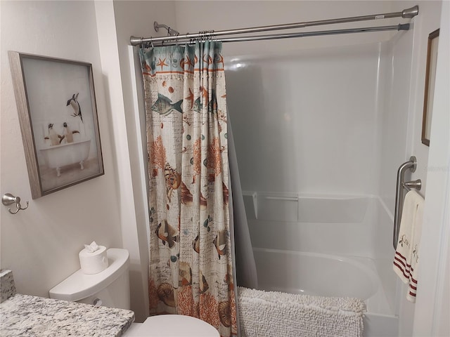 full bathroom featuring shower / bath combo, vanity, and toilet