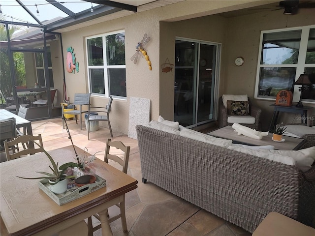 view of patio / terrace with an outdoor living space and a lanai