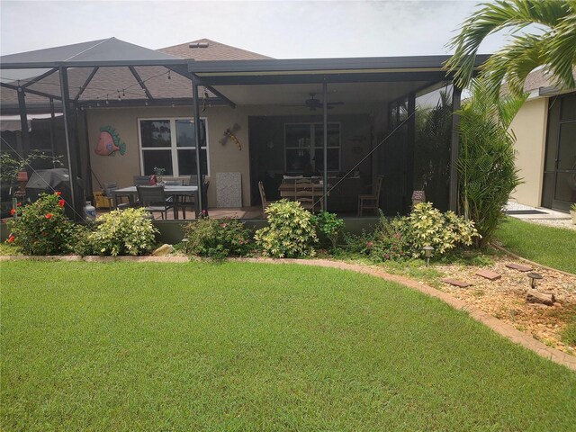 exterior space featuring ceiling fan, glass enclosure, and a patio