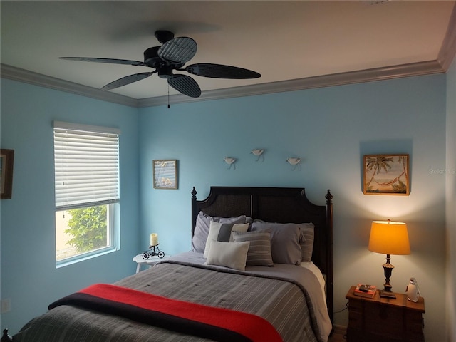 bedroom featuring ornamental molding and ceiling fan