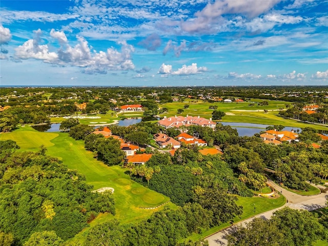 bird's eye view featuring view of golf course and a water view