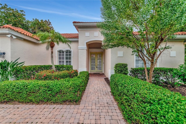 property entrance featuring french doors