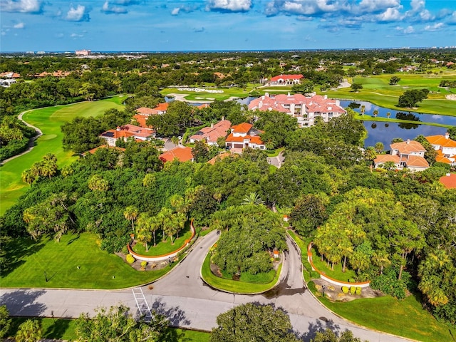 aerial view with golf course view and a water view