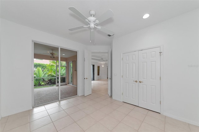 unfurnished bedroom featuring access to outside, light tile patterned floors, recessed lighting, and ceiling fan