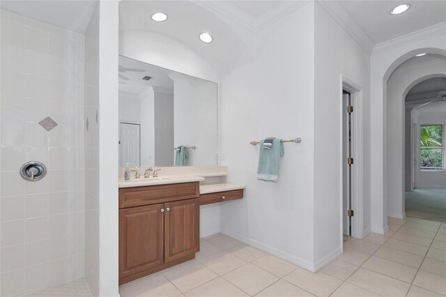 bathroom with vanity, tile patterned floors, baseboards, and ornamental molding