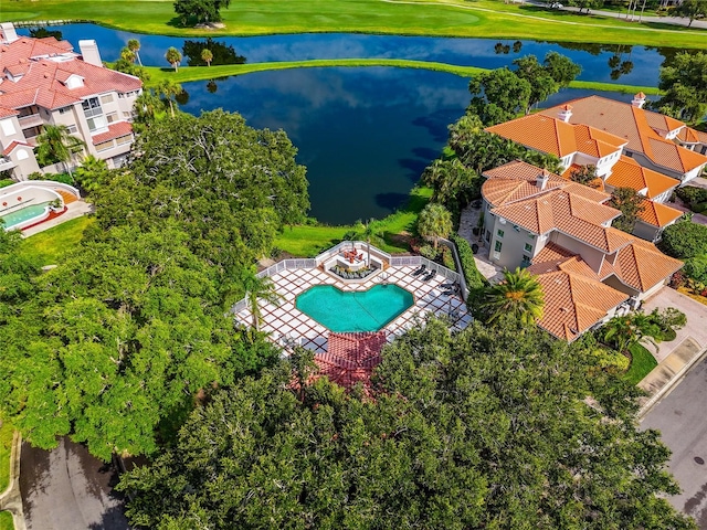 birds eye view of property with a water view and a residential view