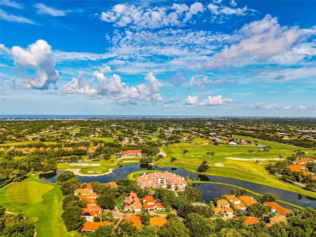 bird's eye view with a water view and golf course view