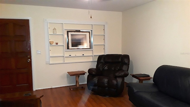 sitting room with hardwood / wood-style flooring