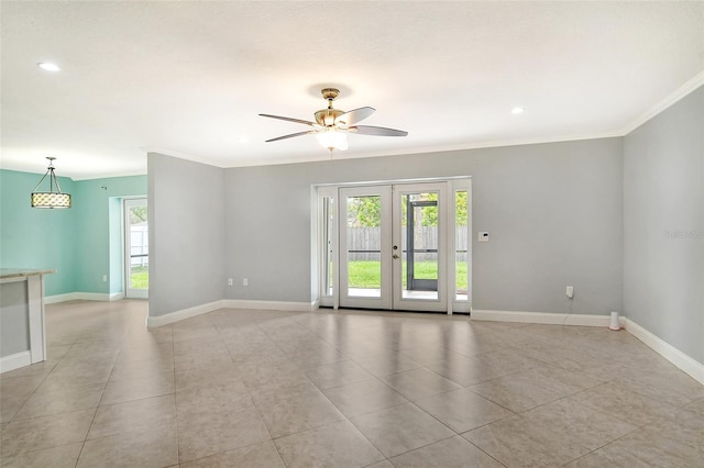 empty room featuring french doors, ceiling fan, crown molding, and light tile patterned floors