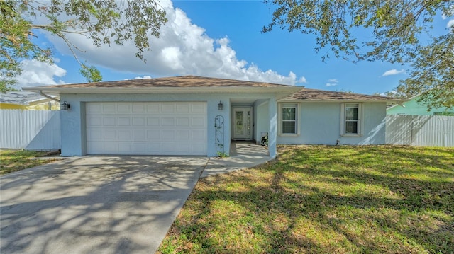 ranch-style home featuring a front lawn and a garage