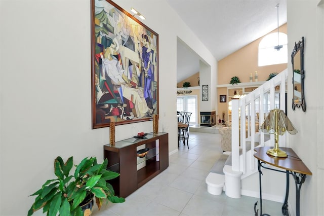 tiled entryway with high vaulted ceiling