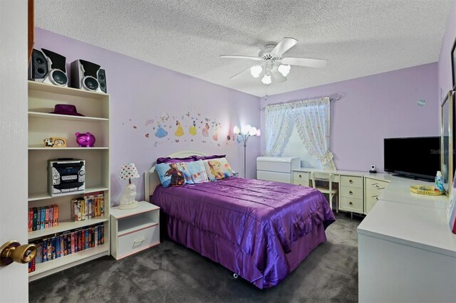 carpeted bedroom featuring a textured ceiling and ceiling fan