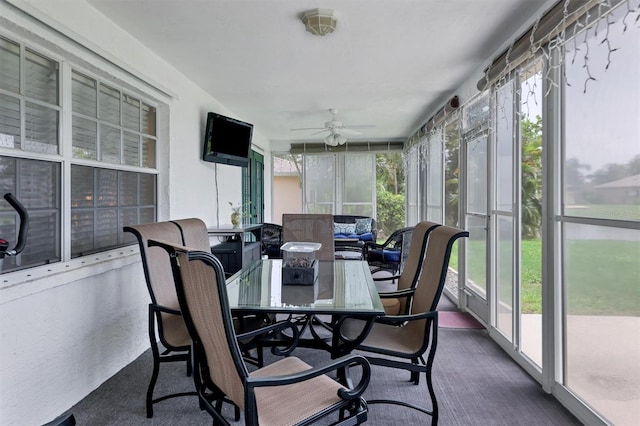 sunroom with a wealth of natural light and ceiling fan