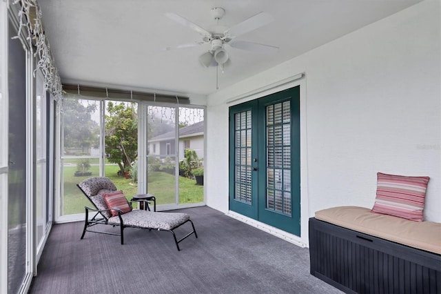 sunroom / solarium with french doors and ceiling fan