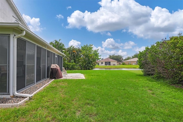 view of yard featuring a sunroom